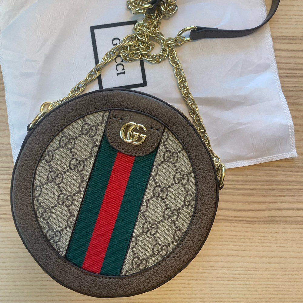 “Gucci” purse - only worn out once!